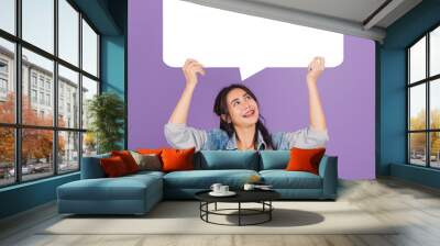 woman smiling excited wear denims hold empty speech bubble sign Wall mural