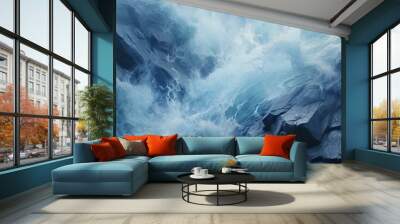 Aerial view of clear ocean waves splashing on dark navy blue sand beach, capturing serene beauty Wall mural