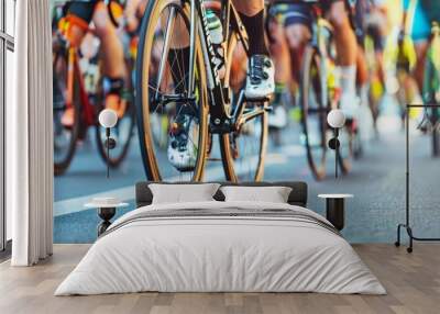 Professional cyclists in racing sports gear riding on open road cycling route in close up view Wall mural