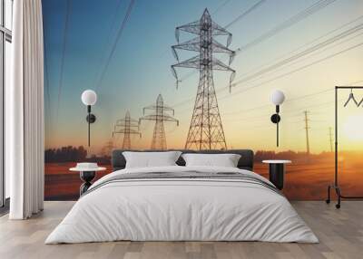 Silhouette of high voltage electric tower against dramatic sunset sky background Wall mural