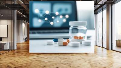 A modern workspace featuring a glass jar of capsules and a digital screen, representing pharmaceutical research and innovation. Wall mural