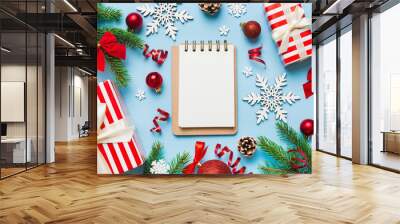 Christmas blank greeting card mock-up scene. Creative layout made of Christmas tree branches and paper card note. Flat lay. Nature New Year concept Wall mural