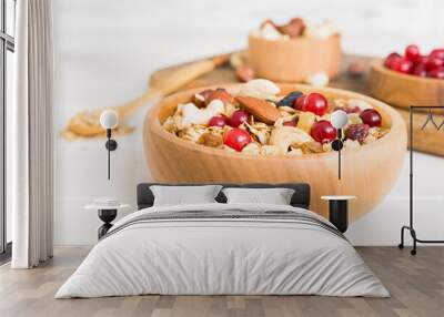 Cooking a wholesome breakfast. Granola with Various dried fruits and nuts in a bowl. The concept of a healthy dessert. Flat lay, top view with copy space Wall mural