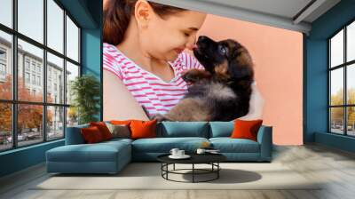 cute German shepherd puppy kissing woman's nose Wall mural