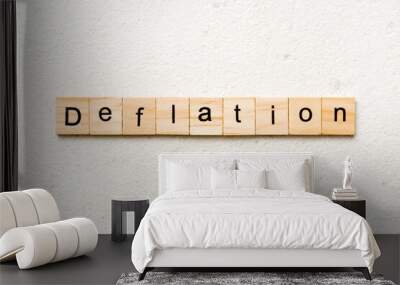 deflation word written on wood block. deflation text on table, concept Wall mural