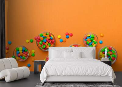 different colored round candy in bowl and jars. top view of large variety sweets and candies with co Wall mural