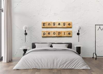 ENGAGE PEOPLE word written on wood block. ENGAGE PEOPLE text on cement table for your desing, concept Wall mural