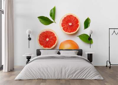 fresh Fruit grapefruit with Juicy grapefruit slices on colored background. Top view. Copy Space. creative summer concept. Half of citrus in minimal flat lay with copy space Wall mural