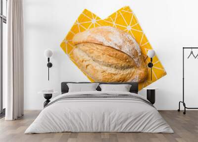 Freshly baked delicious french bread with napkin isolated on white background top view. Healthy white bread loaf Wall mural