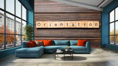 Orientation word written on wood block. Orientation text on wooden table for your desing, concept Wall mural