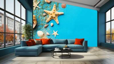 Summer time concept Flat lay composition with beautiful starfish and sea shells on colored table, top view with copy space for text Wall mural