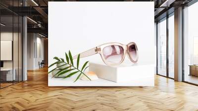 sunglasses with seashell lying on table background. Sunglasses on summer background. Top view flat lay with copy space for text Wall mural