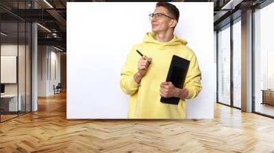 A male designer in yellow hoody holding graphic tablet Wall mural