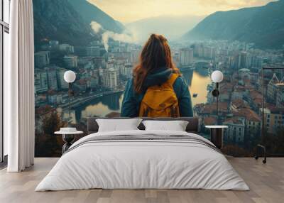 casual solo traveller female woman standing on the hill look over aerial topview of old famous attraction city travel concept carefree leisure freedom concept Wall mural