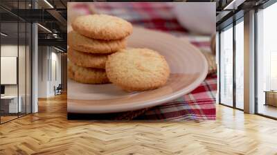 Round sweet cookies. Delicious dessert with high sugar and carbohydrate suitable for eating with milk and tea or coffee on color and white background with colorful placemat Wall mural