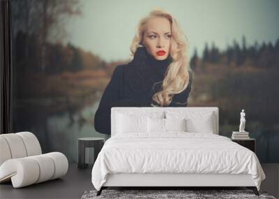 Beautiful elegant woman in a black coat Wall mural