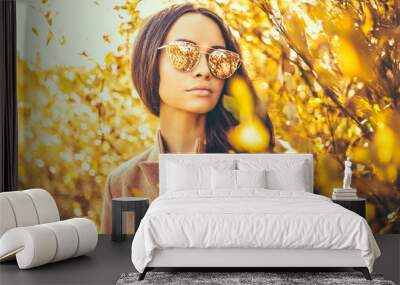 Beautiful lady surrounded autumn leaves Wall mural