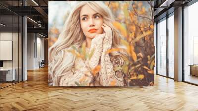 Beautiful lady surrounded autumn leaves Wall mural