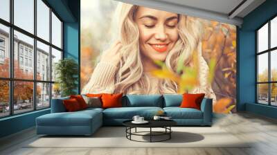 Beautiful lady surrounded autumn leaves Wall mural