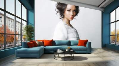 Beautiful woman with elegant hairstyle in white fur coat Wall mural