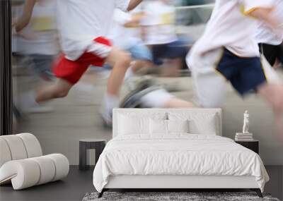 Children running a marathon, motion blurred image Wall mural