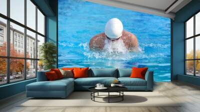 Man swimming Breast stroke in a race Wall mural