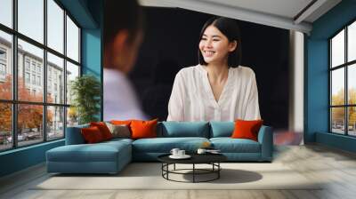 Portrait of cheerful mid adult Chinese businesswoman smiling in business meeting with confident expression Wall mural