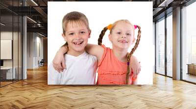 Cute boy and girl hugging isolated on white background Wall mural