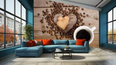 The cup of coffe and Frame- heart from coffee beans and two cook Wall mural