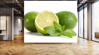 two limes with half of a juicy lime with leaves of mint isolated on white background Wall mural