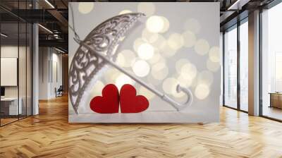 Two red wooden hearts under an umbrella Wall mural