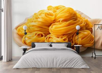 A plate of yellow pasta is piled on top of a cloth Wall mural