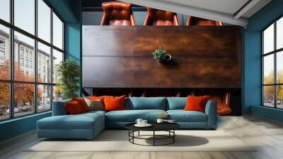 A wooden table with six leather chairs around it Wall mural