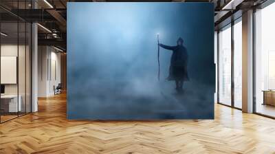 Magician in cloak, cowl with magic stick standing in fog landscape illuminated by blue moon ligh. Fantasy, wizard concept, 3D rendering Wall mural