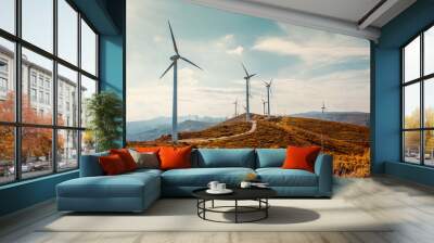 wind turbines on beautiful sunny summer autumn mountain landsape. curvy road through mountain eolic  Wall mural