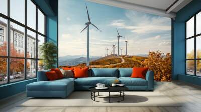 Wind turbines on beautiful sunny summer autumn mountain landsape. Curvy road through mountain Eolic park. Green ecological power energy generation. Wind farm eco field Wall mural