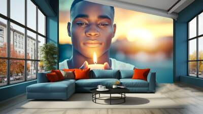 A man holding a candle in his hand Wall mural