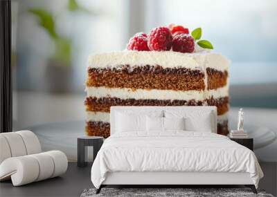 A slice of cake with raspberries on top Wall mural