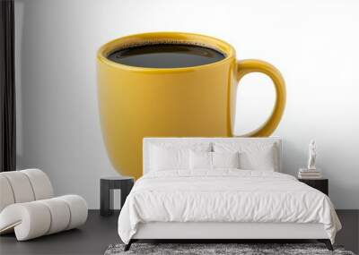 A yellow coffee mug with a dark brown liquid inside Wall mural