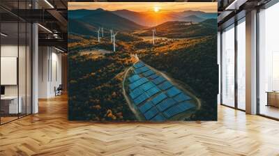 Aerial view of solar panels and wind turbines at sunset in a beautiful landscape Wall mural