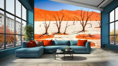 Ancient, bleached trees stand starkly against a backdrop of towering orange dunes and a vast, white clay pan, creating a surreal and otherworldly landscape. 1 Wall mural