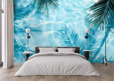 Top view of palm leaf shadow and sun light reflect on clear water surface with white sand background.Summer background.vacation at beach concept. Wall mural