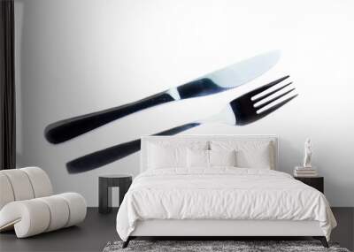 Metal fork and knife on a white background viewed from above Wall mural