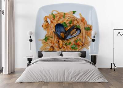 Pasta with mussels on plate on white background top view Wall mural