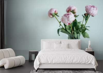 Beautiful pastel pink peonies in vase in minimalistic interior Wall mural