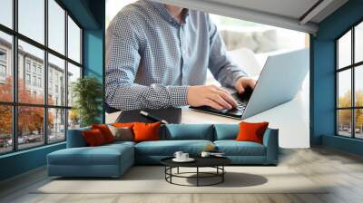 Closeup photo of man working with laptop Wall mural