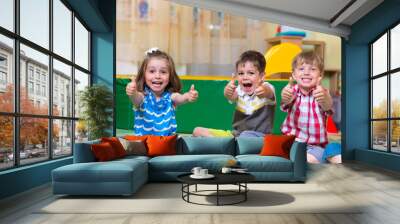 excited children holding thumbs up Wall mural