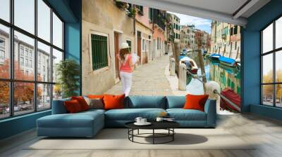 Happy woman with map in Venice Wall mural