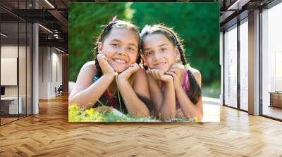 Image of two happy sisters having fun Wall mural