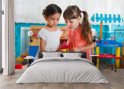 two little girls playing in daycare Wall mural